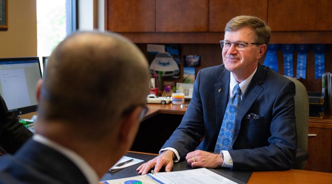 Scott talking to clients